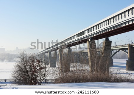 NOVOSIBIRSK, RUSSIA - DECEMBER 20, 2014: Metro bridge across the Ob river in a winter day. It is the world longest metro bridge with the length 2145 m
