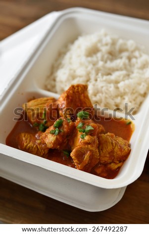 Chicken curry with rice in a disposable container