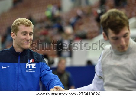 ST. PETERSBURG, RUSSIA - MAY 3, 2015: Julien Mertine of France handshakes with German athlete after the team quarterfinal of International fencing tournament St. Petersburg Foil, stage of World Cup