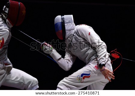 ST. PETERSBURG, RUSSIA - MAY 3, 2015: Final match Russia vs China during 41th International fencing tournament St. Petersburg Foil. The tournament is the stage of FIE World Cup