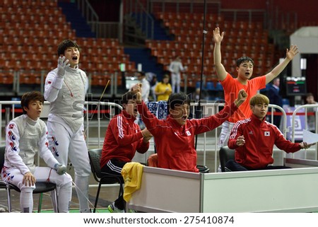 ST. PETERSBURG, RUSSIA - MAY 3, 2015: Korean team reacts during team quarterfinal match against Italy in the International fencing tournament St. Petersburg Foil. The tournament is the stage of FIE World Cup