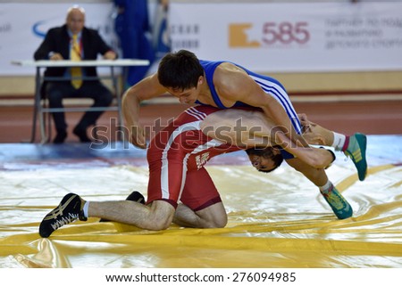 ST. PETERSBURG, RUSSIA - MAY 6, 2015: Unidentified wrestlers during International freestyle wrestling tournament Victory Day. This traditional competitions dedicated to the Victory in WWII