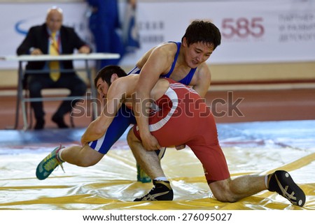 ST. PETERSBURG, RUSSIA - MAY 6, 2015: Unidentified wrestlers during International freestyle wrestling tournament Victory Day. This traditional competitions dedicated to the Victory in WWII