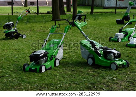 ST. PETERSBURG, RUSSIA - JUNE 4, 2015: Petrol mowers of Austrian company VIKING on a lawn in the Mikhailovsky Garden during the festival Emperor\'s Gardens of Russia. VIKING is a member of STIHL group