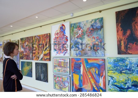 ST. PETERSBURG, RUSSIA - JUNE 7, 2015: Spectator at first exhibition of the project \