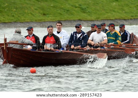 ST. PETERSBURG, RUSSIA - JUNE 12, 2015: Competition of Viking boats during the Golden Blades Regatta. This kind of competitions make the race accessible for not only professional athletes but amateurs