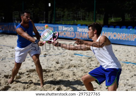 MOSCOW, RUSSIA - JULY 15, 2015: Georgios Martinis (left) and Grigorios Raptis of Greece in action during the ITF Beach Tennis World Team Championship. 28 nations compete in the event this year