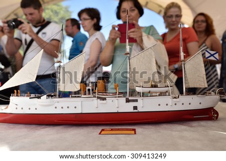 ST. PETERSBURG, RUSSIA - AUGUST 15, 2015: People on the exhibition of the sailing ship models during the International marine festival. The fest is main event of the Great St. Petersburg Sailing Week