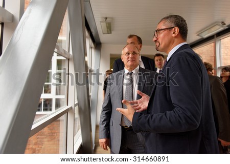 ST. PETERSBURG, RUSSIA - SEPTEMBER 3, 2015: Director of local Campus Sergey Kadochnikov (right) and Vice-Governor of city Vladimir Kirillov in the new academic building of Higher School of Economics