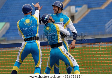 ST. PETERSBURG, RUSSIA - SEPTEMBER 9, 2015: Team Kazakhstan celebrate good result in competitions in combat deployment during XI World Championship in Fire and Rescue Sport