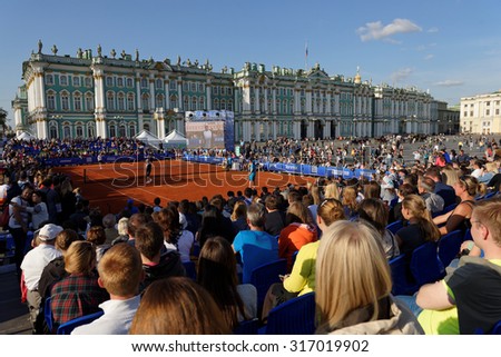 ST. PETERSBURG, RUSSIA - SEPTEMBER 12, 2015: People watching exhibition match of International tennis tournament St. Petersburg Open. The match was held on the Palace square during City\'s Tennis Day.