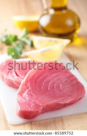 Raw tuna steaks on a cutting board