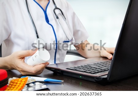 Doctor working with laptop in the office