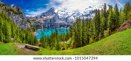Amazing tourquise Oeschinnensee with waterfalls and Swiss Alps, Kandersteg, Berner Oberland, Switzerland. Stockfoto © 