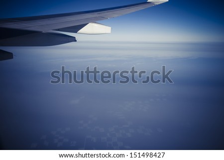 View to horizont and clouds from the plane during the flight