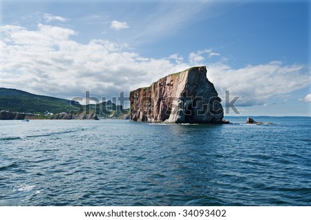 view of Perce Rock in Gaspesie from a boat at its tip