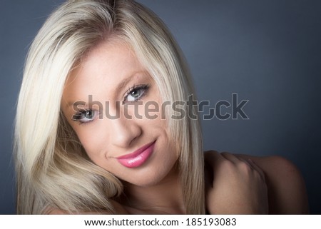 Attractive Young Blond with green eyes smiling