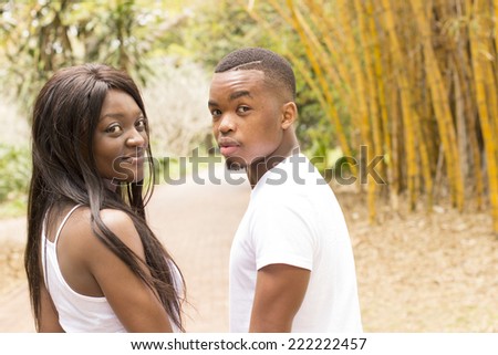 Young African American Couple walking hand in hand