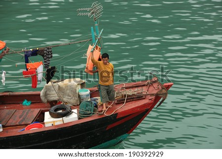 Halong Bay, Vietnam -Ã?Â� April 10, 2014: Fishing boat in Halong Bay used predominantly to supply the local floating villages. Halong Bay is a UNESCO World Heritage Site.