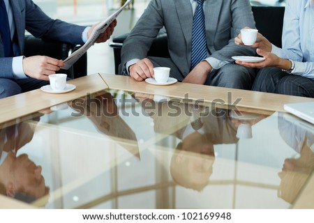 Business team having a break by cup of coffee