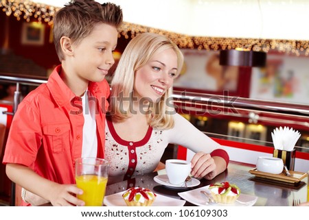 Mother and son spending time together at the coffee house