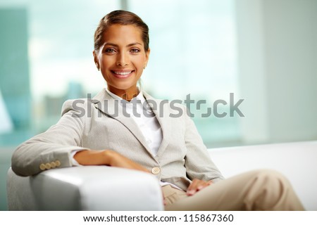 Portrait of successful female sitting in office