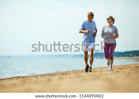 Similar – Image, Stock Photo Sportsman jogging on sandy terrain in mountainous terrain