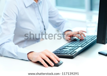 Close-up of female hands during computer work