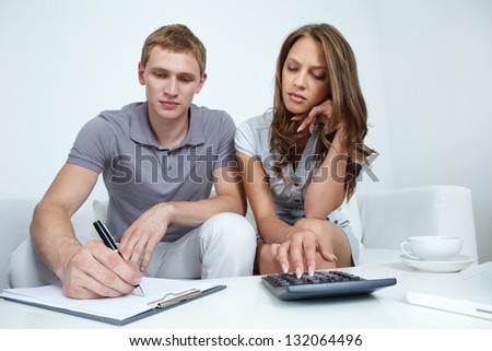 Young couple planning their budget