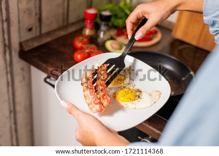 Similar – Image, Stock Photo Ethnic woman eating breakfast on bed