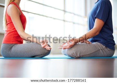 Woman and man meditating face to face