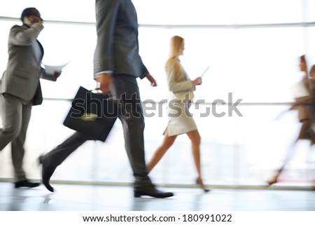 White collar workers hurrying to work at the beginning of working day