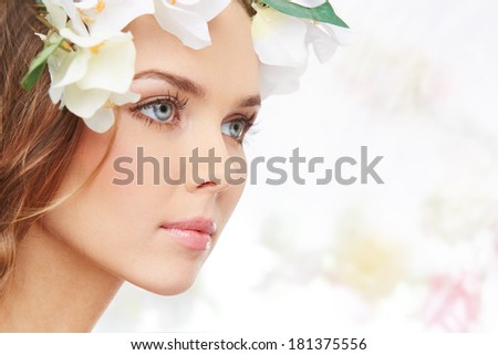 Portrait of an attractive young woman symbolizing coming of spring