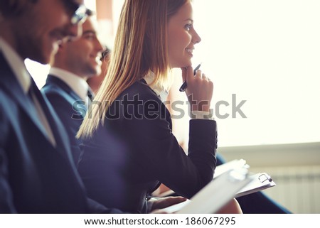 Similar – Image, Stock Photo Focused female making notes during psychotherapy session