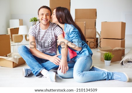 Happy young couple in their new flat
