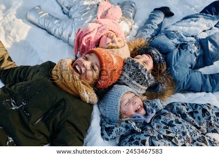 Image, Stock Photo Group of children playing on beach next to cave