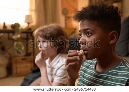 Similar – Image, Stock Photo Focused boy watching films on tablet
