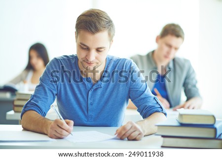 Serious student during written exam