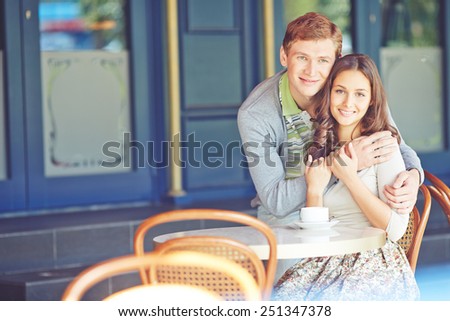 Affectionate young couple spending time in cafe