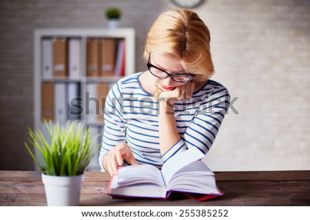 Similar – Image, Stock Photo Interested woman reading book at window sill at home