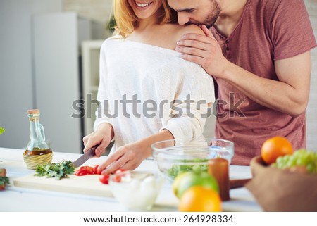 Similar – Image, Stock Photo Couple kissing in kitchen on counter