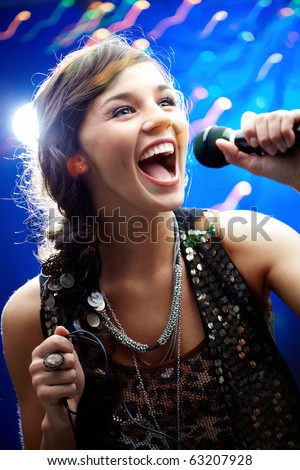 Similar – Image, Stock Photo young singer with an accustical guitar at the door of a church.