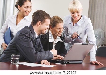 Business woman demonstrating correct way of analysis to three co-workers