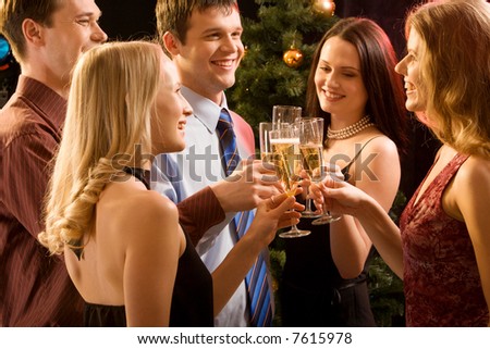 Group of  people  raising up bocals of champagne making a toast