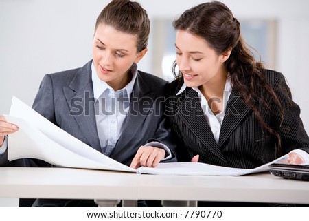Two business women working together in the office