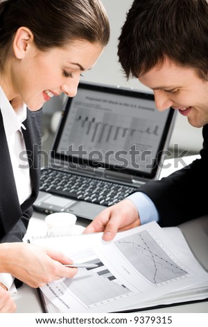 Image of two business people planning a new project in a working environment