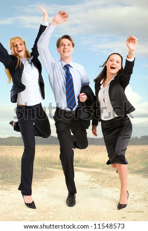 Portrait of happy business people standing on the road