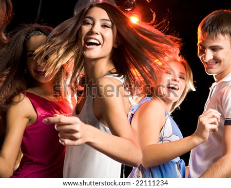 Portrait Of Laughing Girl Looking At Camera While Dancing Among Her ...