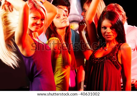 Group Of Fashionable Girls Dancing In The Night Club Stock Photo ...