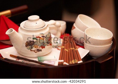 CHELYABINSK ? NOVEMBER 17: Sushi master class, Holiday Inn Chelyabinsk-Riverside 4*. Teapot, cups, cigarettes and chopsticks on tray